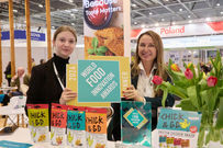 MHP Chick & Go winners at the World Food Innovation Awards 2024, with their product on display alongside their winner trophy and logo